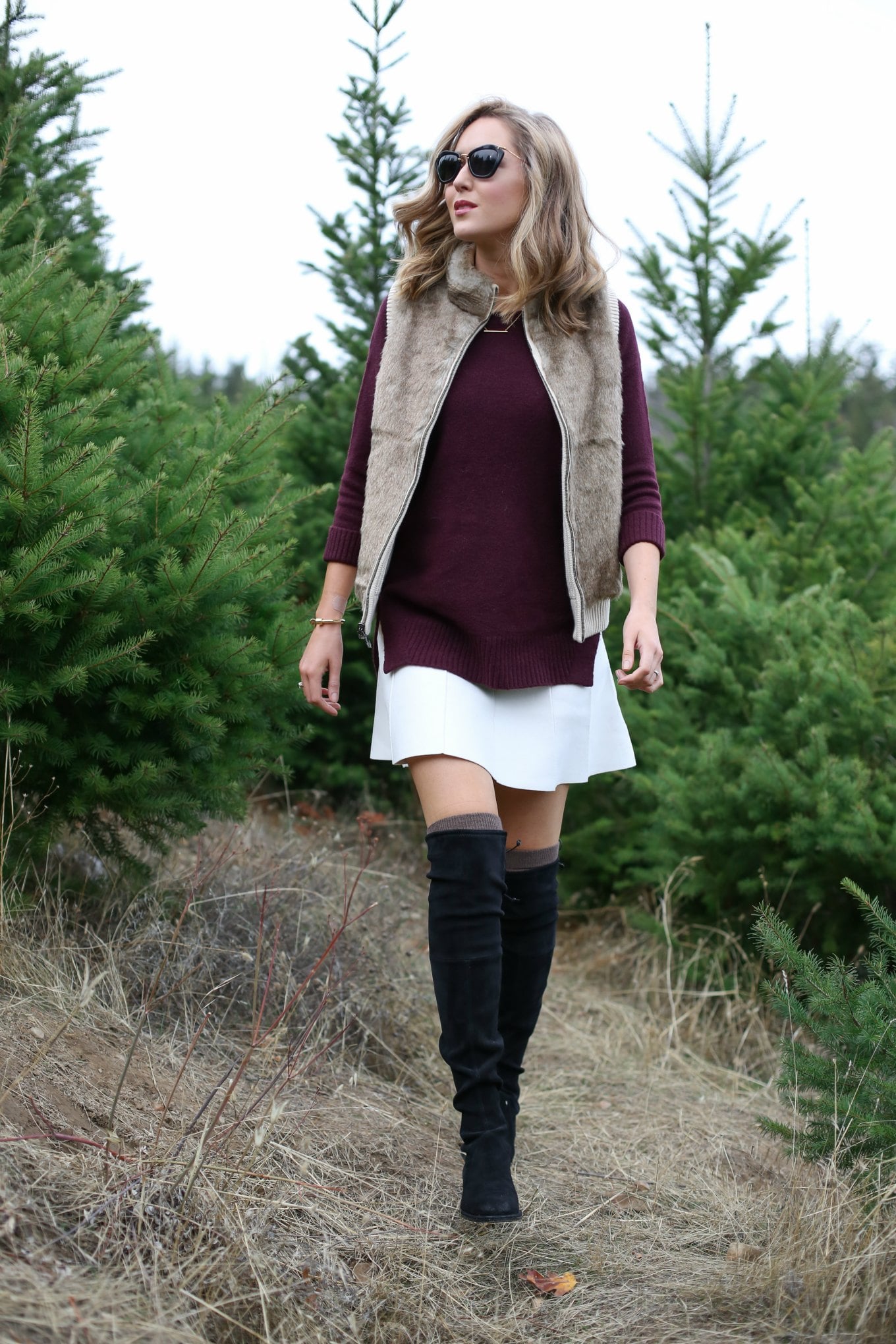 fur vest and over the knee boots