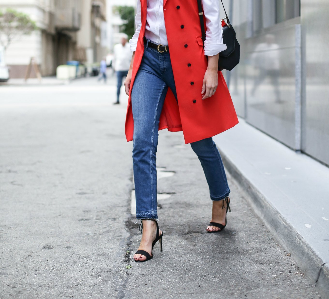 red trench vest fray hem jeans