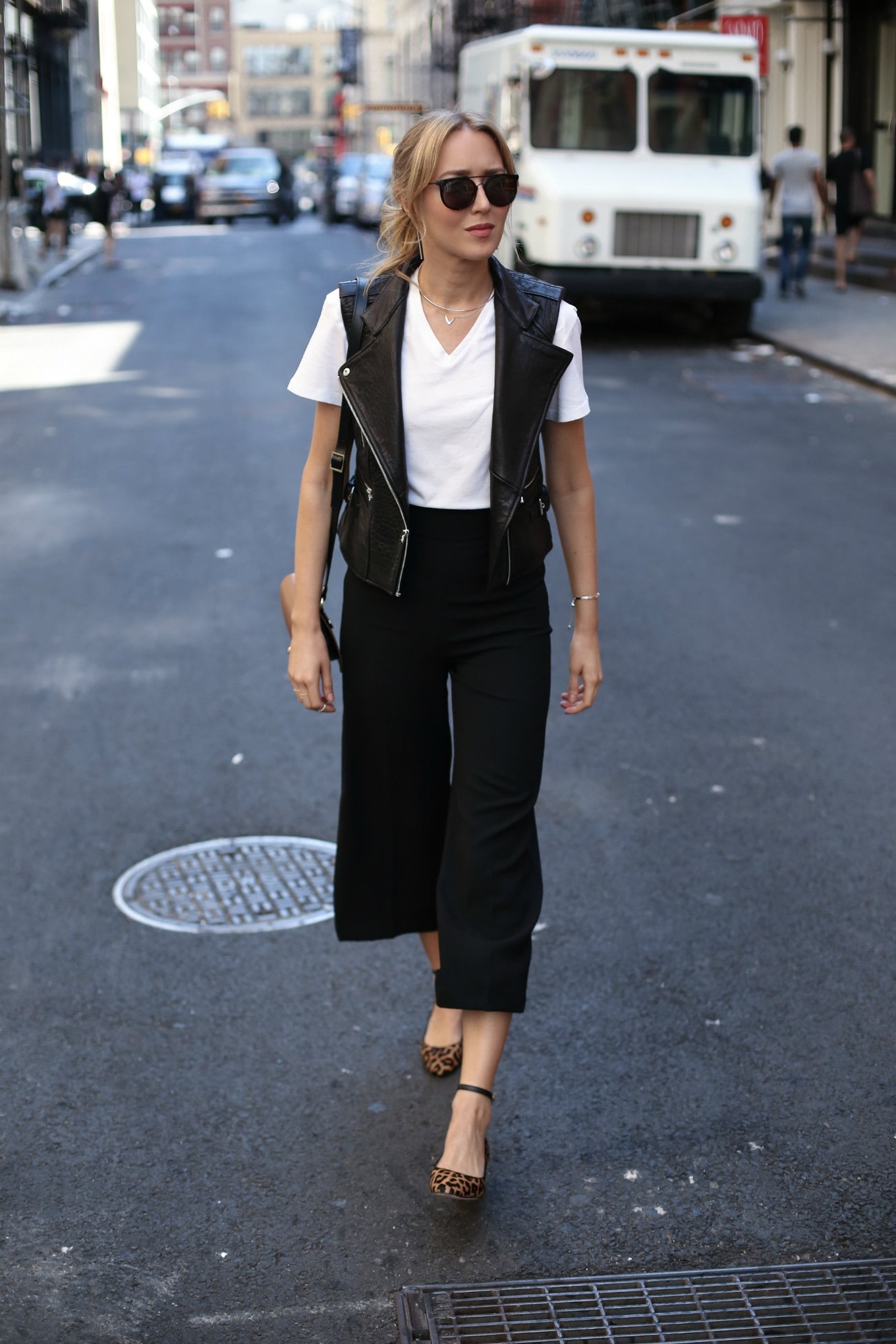 white tee black leather vest culottes leopard block heels