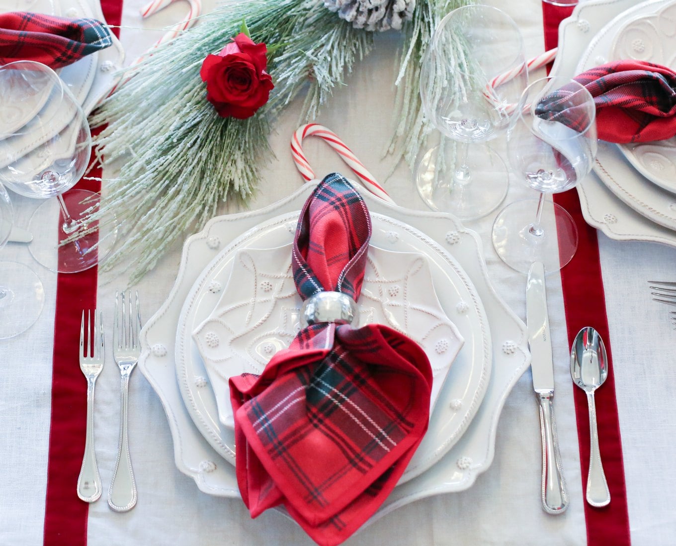 christmas-holiday-dinner-tablescape-table-centerpiece-ideas-tips-garland-roses-berries-juliska-red-plaid-napkins-candles-candy-canes-velvet-runner-7