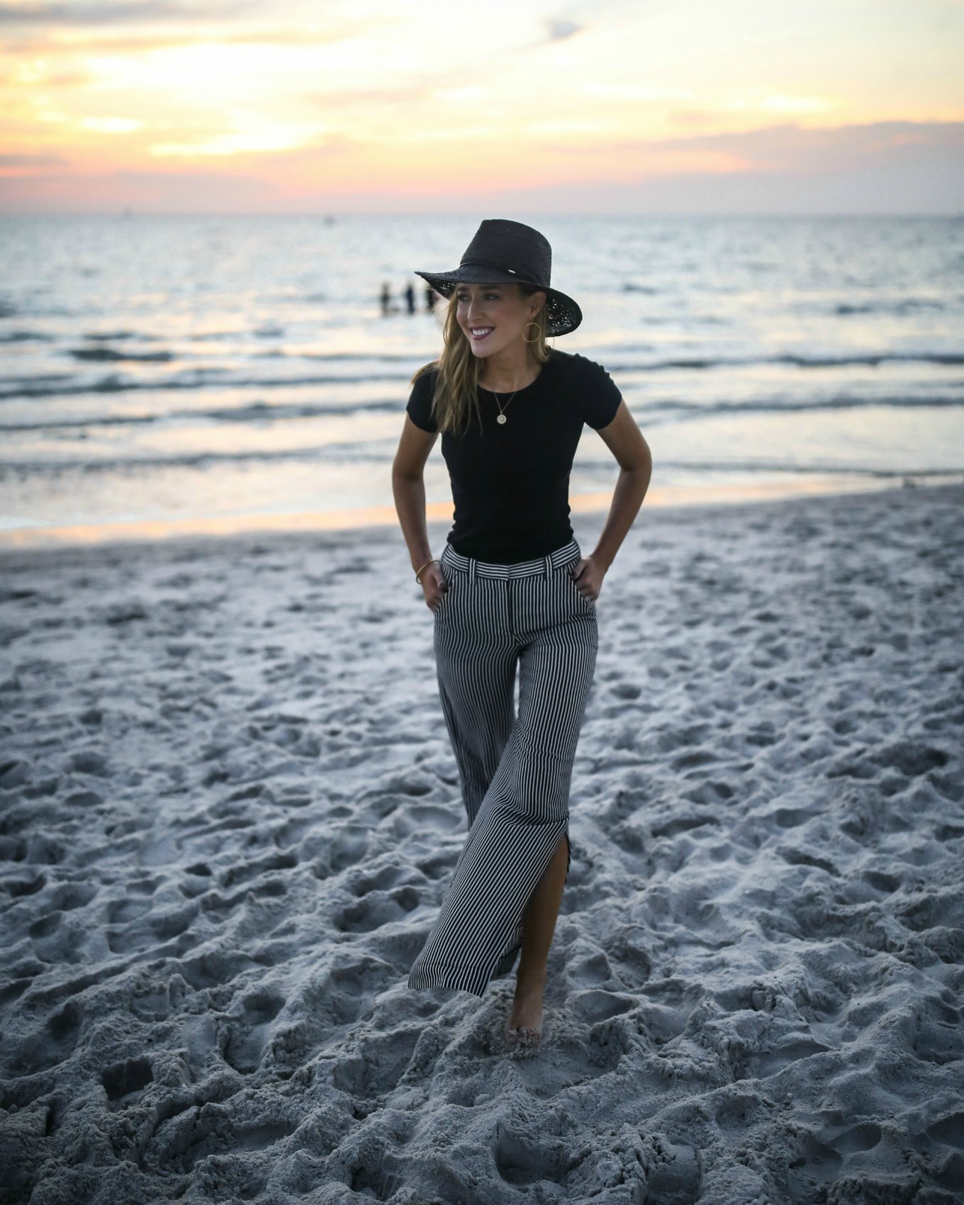alc-striped-silk-split-leg-pants-black-short-sleeve-jcrew-shirt-black-straw-wide-brim-fedora