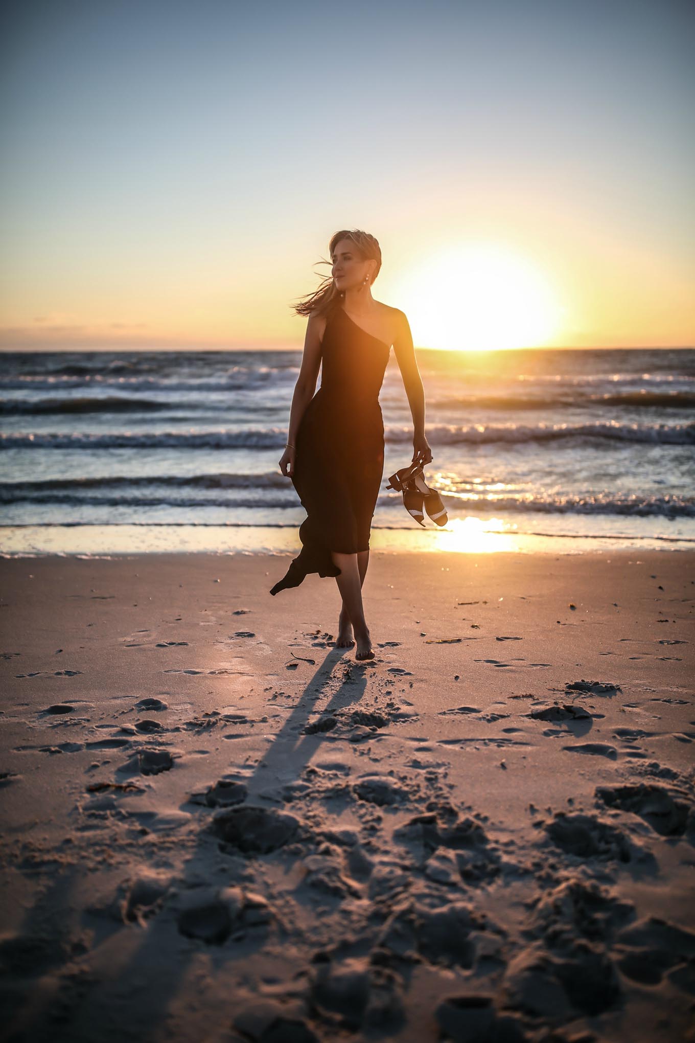 black-one-shoulder-knit-midi-dress-striped-block-heel-sandals-classic-beach-style-black-white-statement-drop-earrings