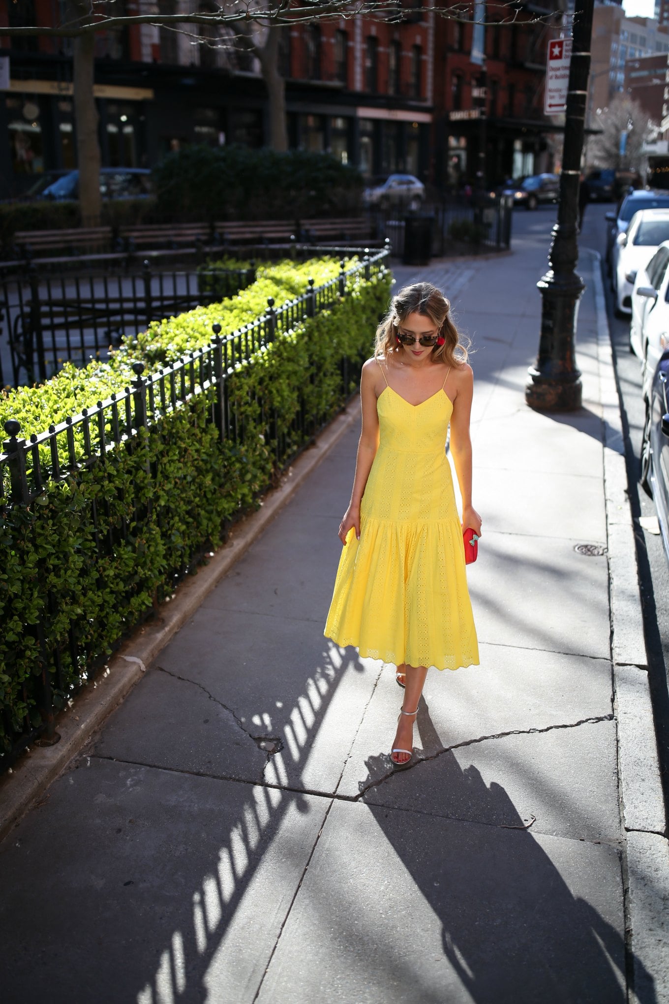 top-spring-fashion-trends-yellow-eyelet-j-crew-midi-dress-silver-metallic-heeled-sandals-red-clutch-tassel-earrings4
