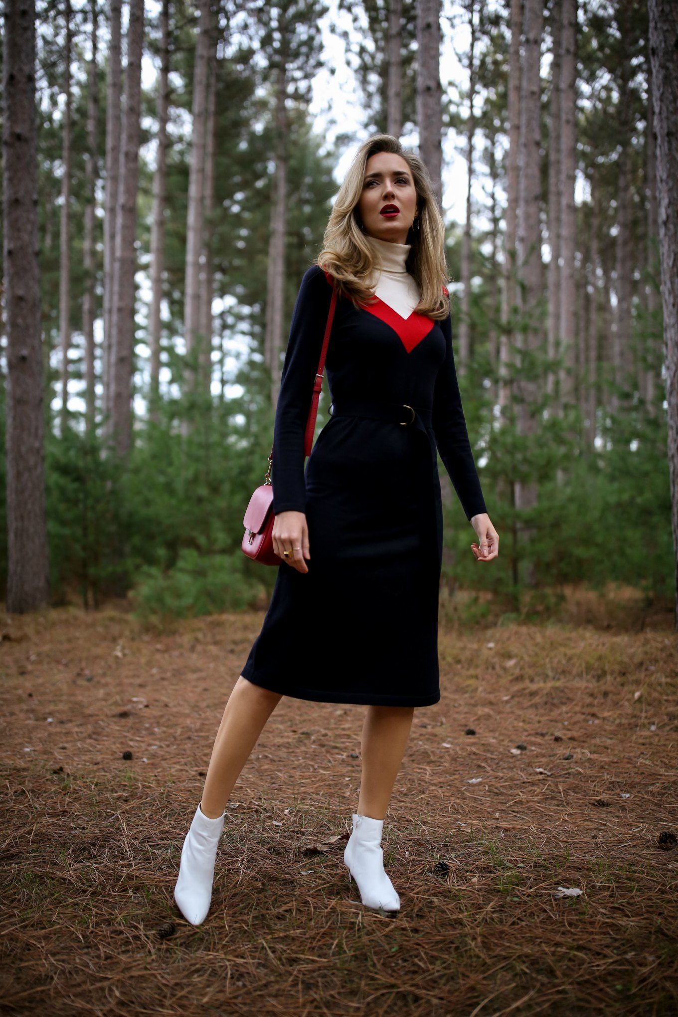 Mary Orton of Memorandum wears a Tory Burch turtleneck sweater dress, white Halogen ankle boots, a red leather cross body bag and a dark red lip for a Ski Trip