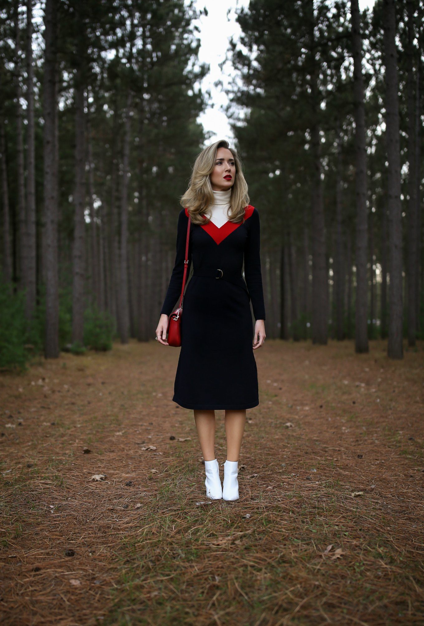 Mary Orton wears a Tory Burch turtleneck sweater dress, white Halogen ankle boots, a red leather cross body bag and a dark red lip for a Ski Trip