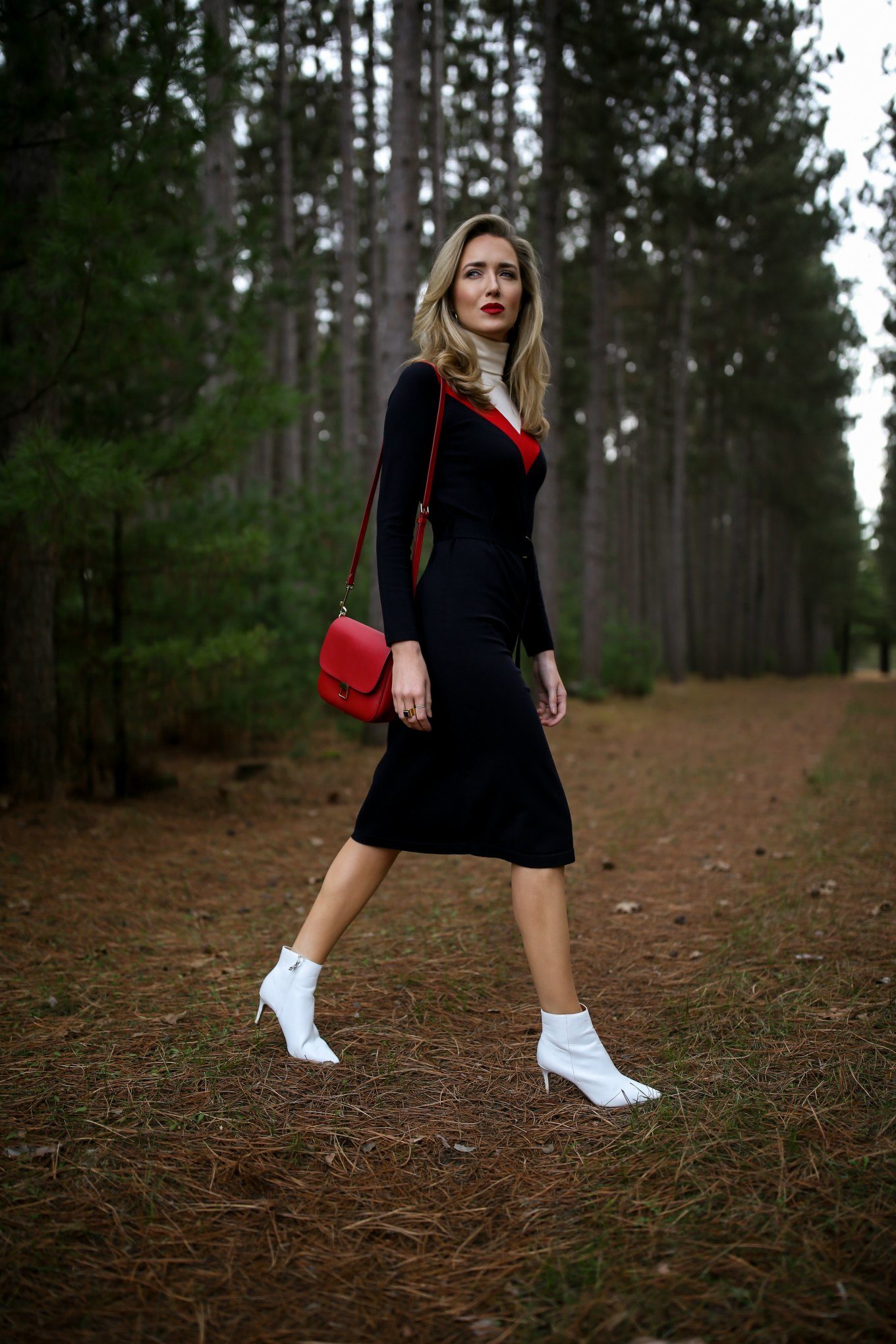 Mary Orton of Memorandum wears a Tory Burch turtleneck sweater dress, white Halogen ankle boots, a red leather cross body bag and a dark red lip for a Ski Trip