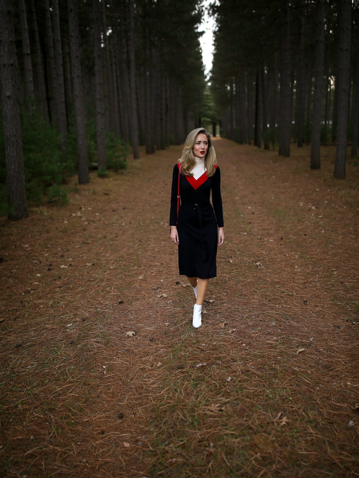 NYC fashion blogger Mary Orton of Memorandum wears a Tory Burch turtleneck sweater dress, white Halogen ankle boots, a red leather cross body bag and a dark red lip for a Ski Trip