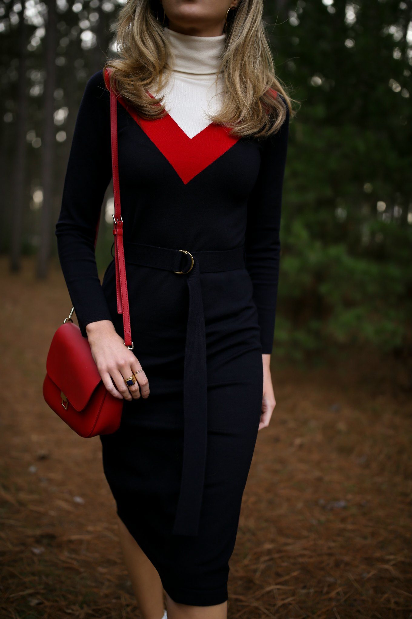 Mary Orton of Memorandum wears a Tory Burch turtleneck sweater dress, a red leather cross body bag and a dark red lip for a Ski Trip