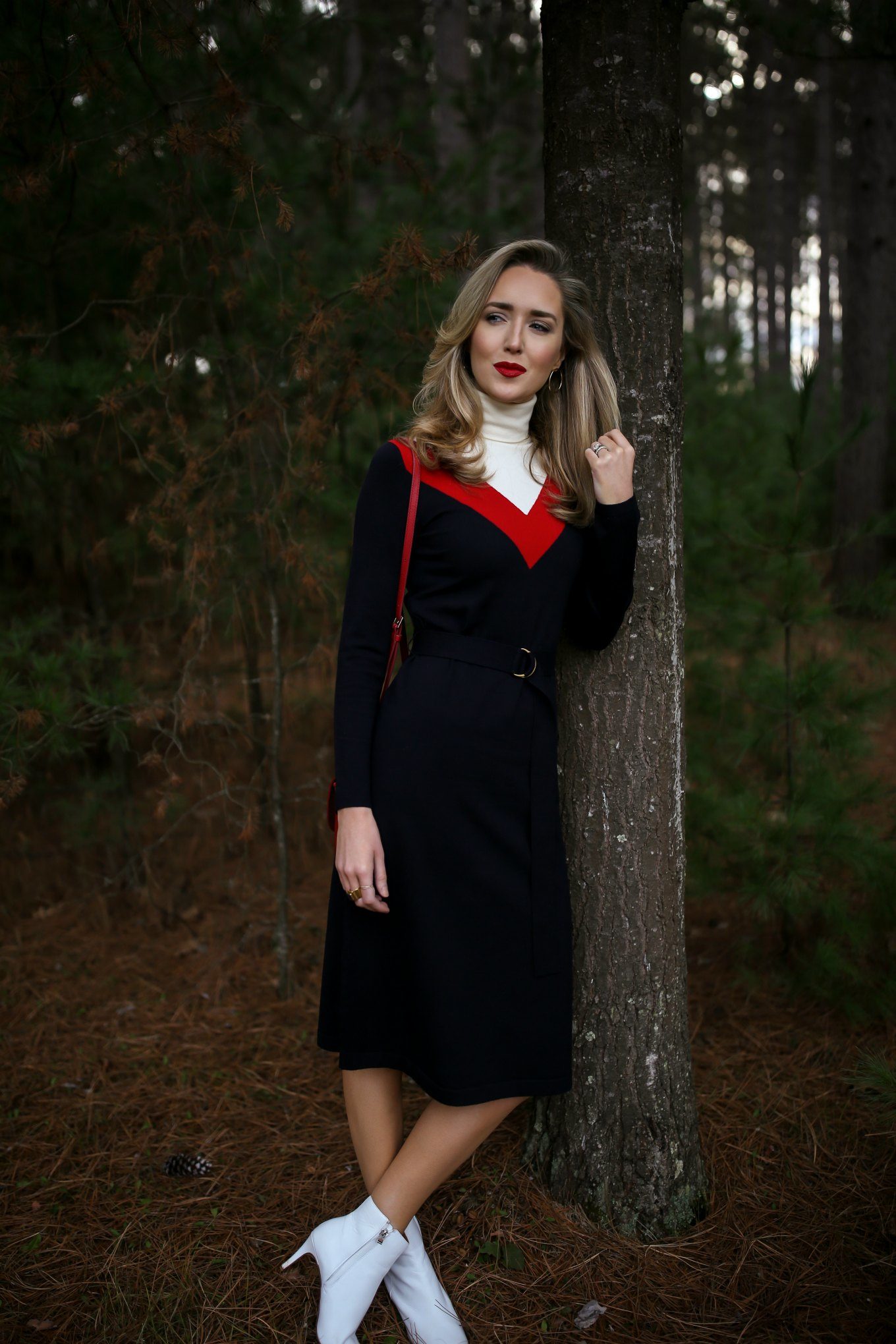 Mary Orton wears a Tory Burch turtleneck sweater dress, white Halogen ankle boots, a red leather cross body bag and a dark red lip for a Ski Trip