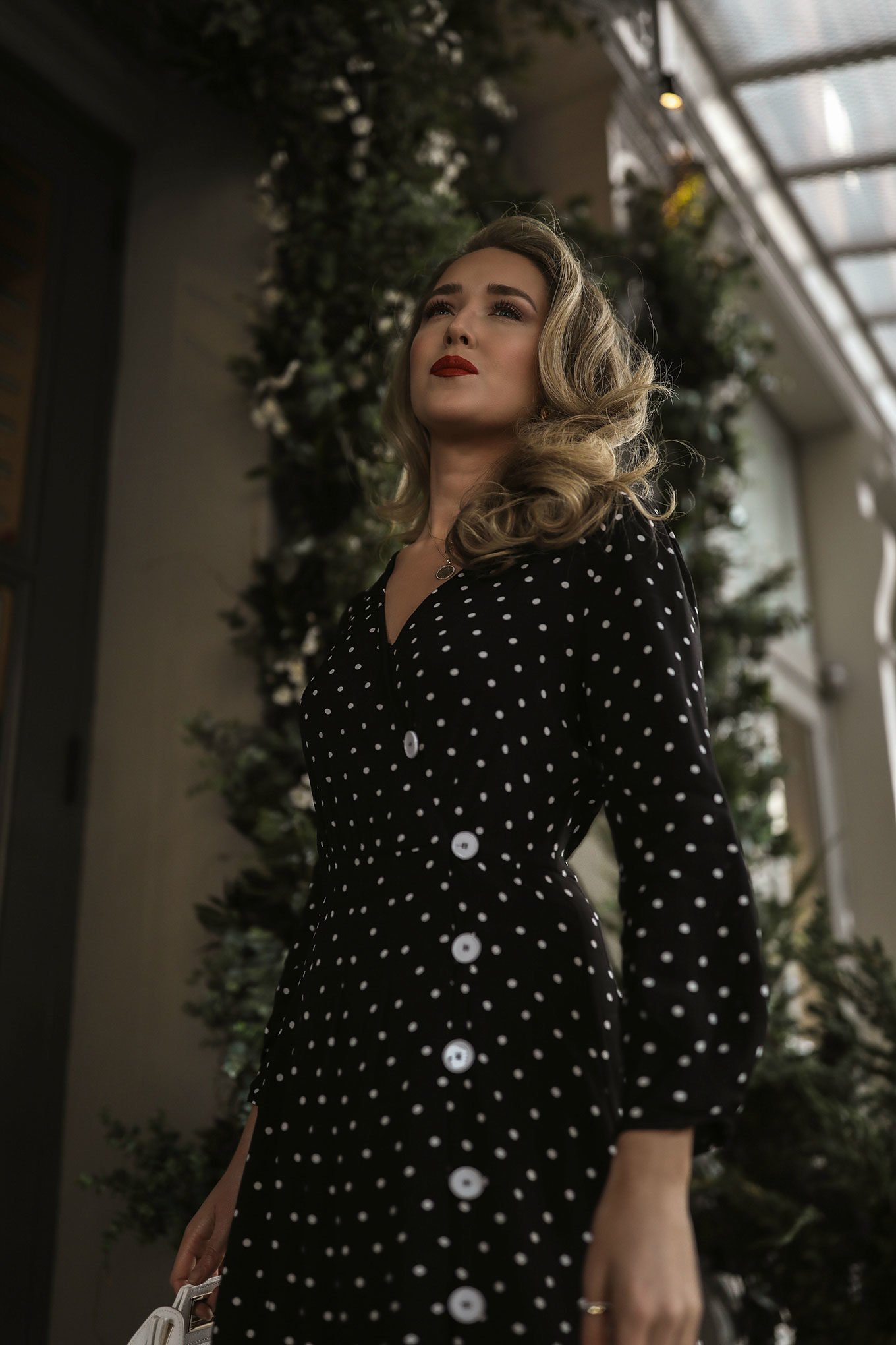 NYC style blogger Mary Orton wearing a black polka dot Mango dress for baby shower